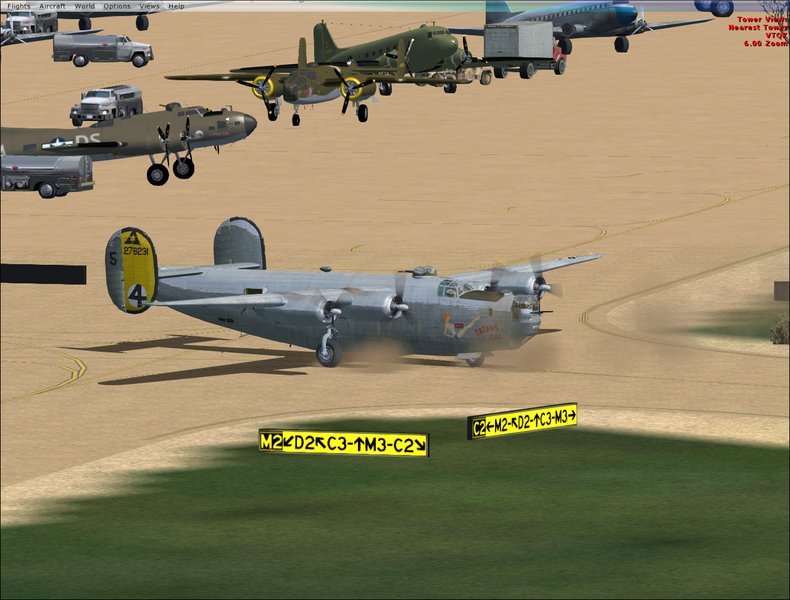 B-24 taxiing past B-17, B-25, and C-47's.
